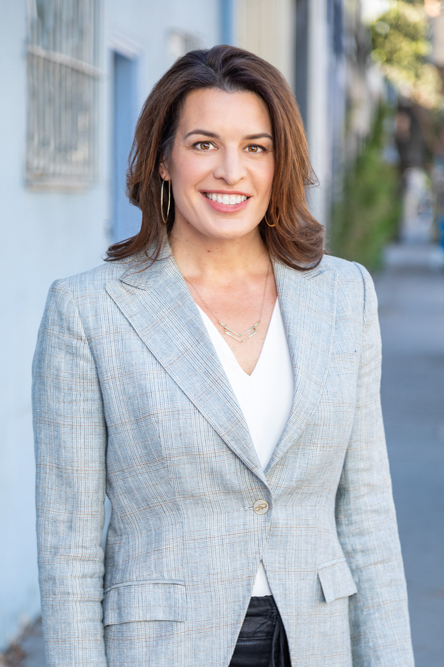 Headshot of Woman in Suit in City