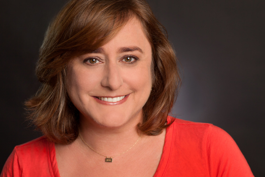 Headshot of Julie Feinstein Adams on Dark Background