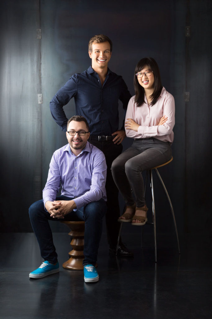 Portrait of 3 People in Front of Metal Background